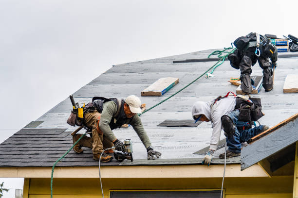 Professional Storm Damage Roof Repair technician working in North Windham, ME